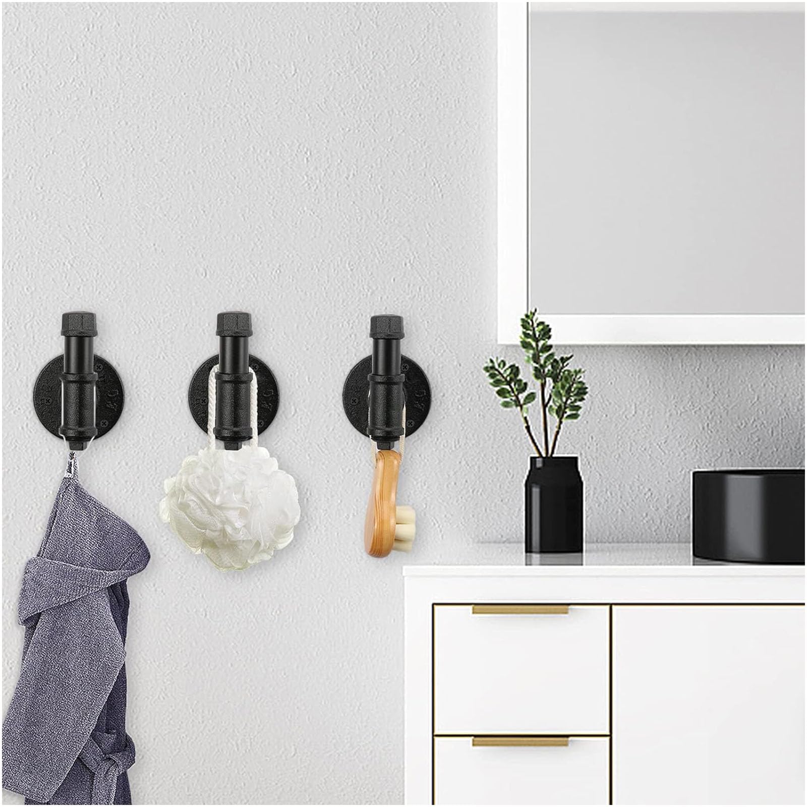 Jeasor industrial pipe hooks in entryway scene for coats and bags.