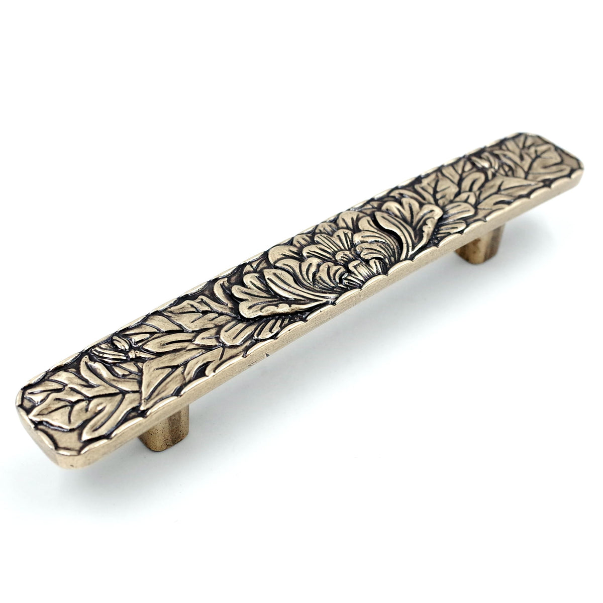 JETLAND bridged drawer pulls in antique brass with a peony motif for durable cabinet updates.