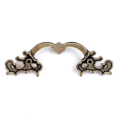 Antique brass Jetland drawer pulls adding vintage charm to dresser or cabinet.