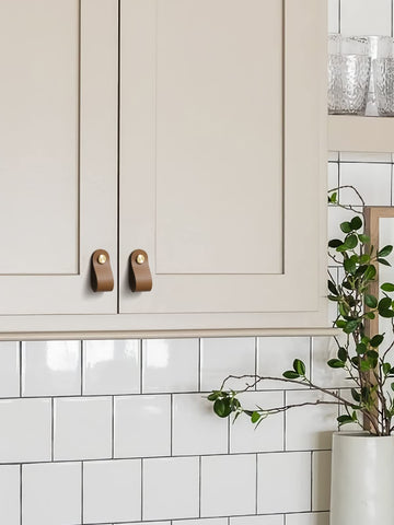 JIASENBAO brown leather drawer pulls on a dresser front for refined style.