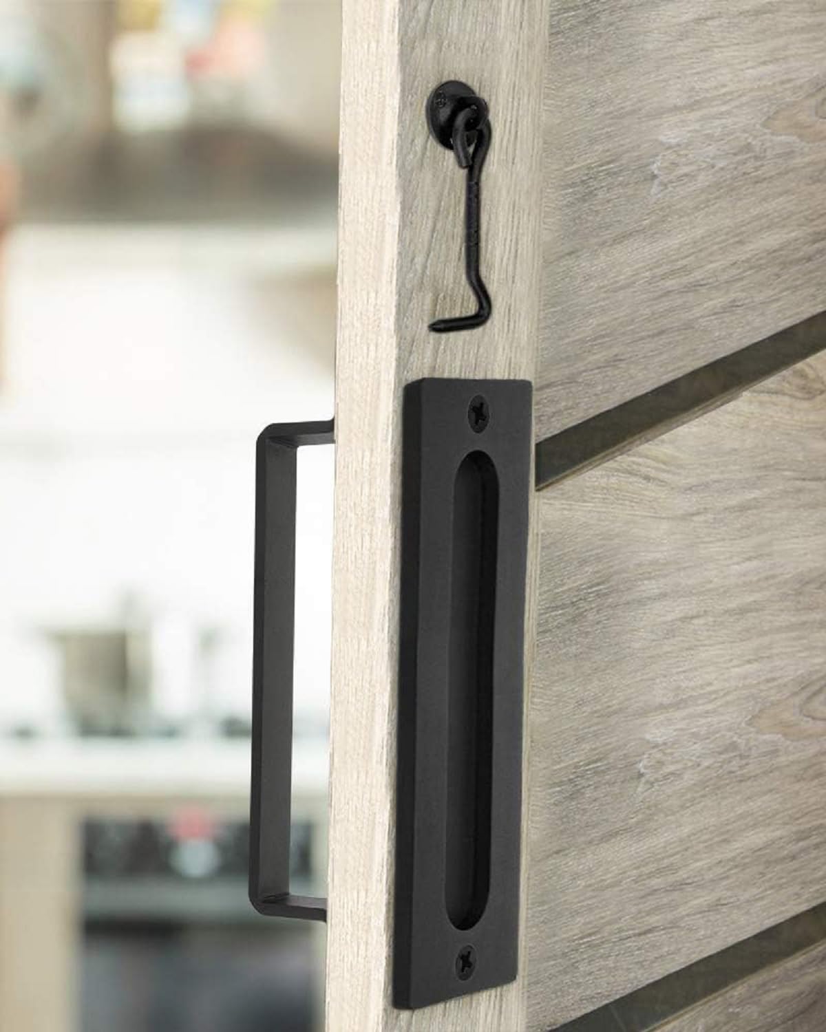 J JHOUSELIFESTYLE lock latch feature on matte black barn door handle.