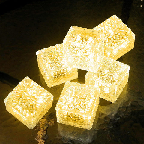 JKIMK solar brick light illuminates outdoor patio with warm glow.