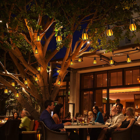 Jnaurb ten flickering flame bulbs create cozy ambiance outdoors.