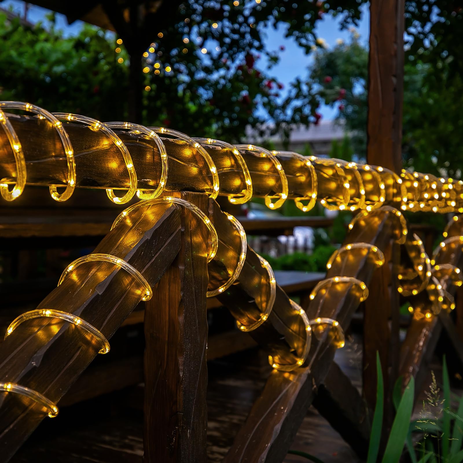 Jnaurb solar rope lights brighten a patio with a warm white glow.