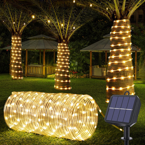 Jnaurb solar rope lights wrap around a tree for ambient evening ambiance.