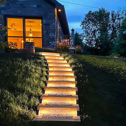 JOFIOS Solar Step Lights enhance garden pathways with ambient glow at dusk.