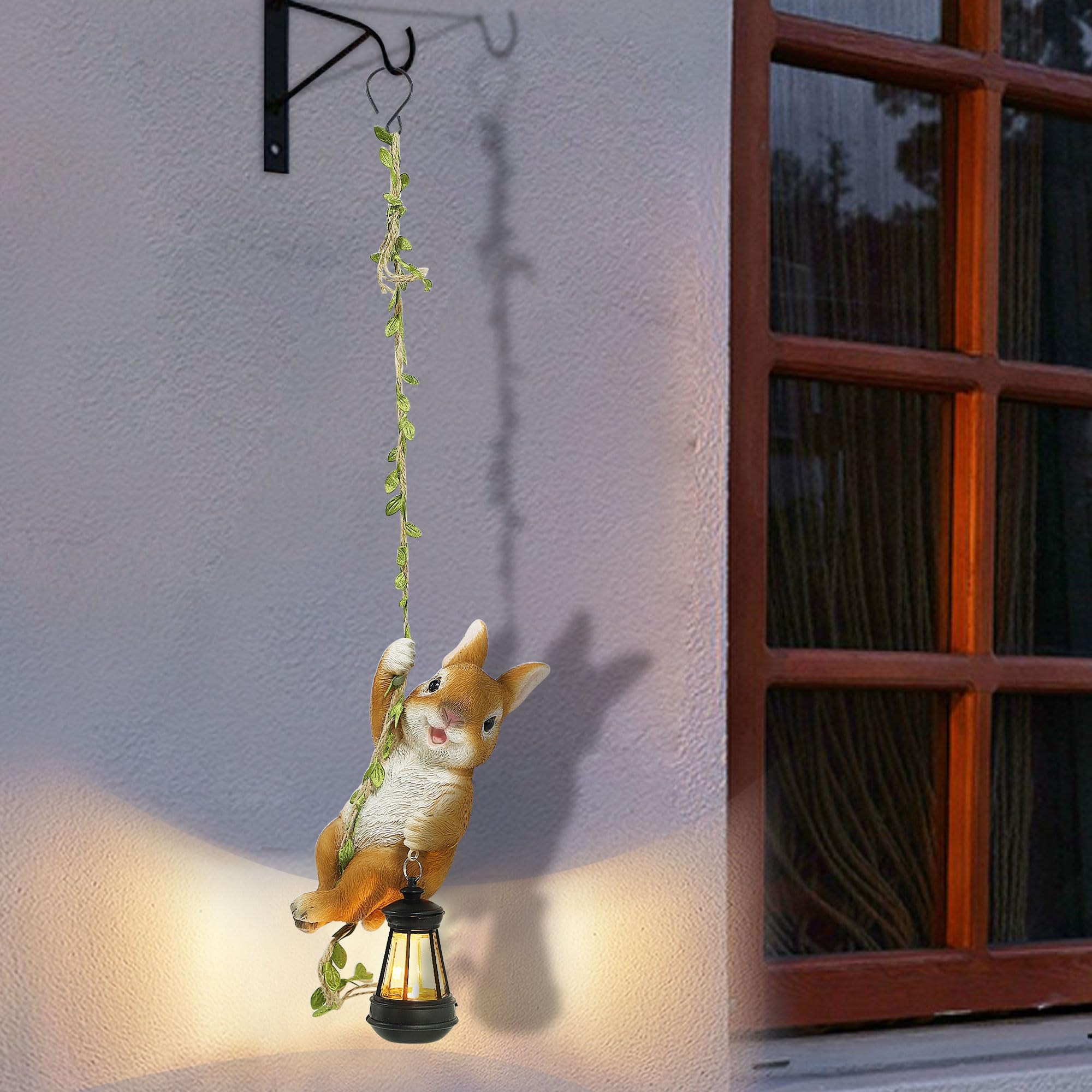 Joliyoou luminous bunny statue enhances curb appeal at dusk.