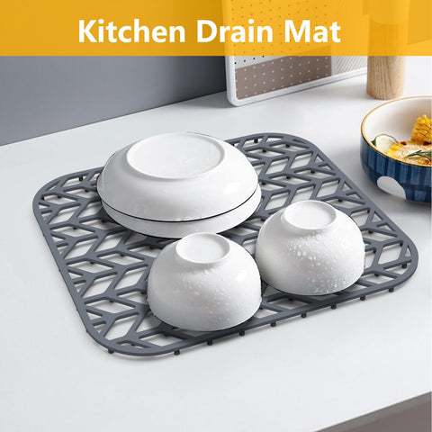 JOOKKI gray silicone mat used as dish rack, aiding drainage toward the sink.