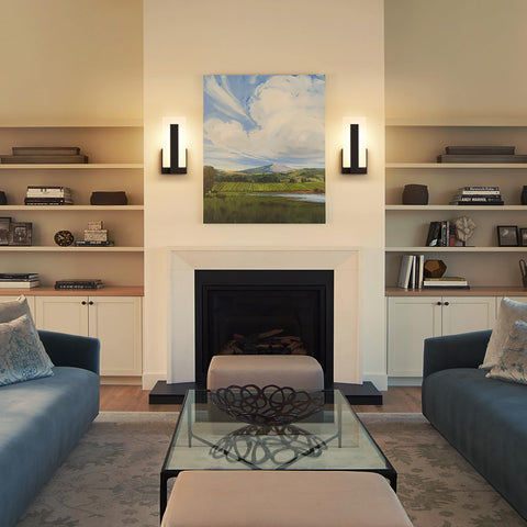 Joosenhouse black wall lamp offers warm inviting glow for bedrooms.