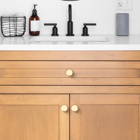 Joy Decor knob installed on a drawer demonstrates champagne gold accent.