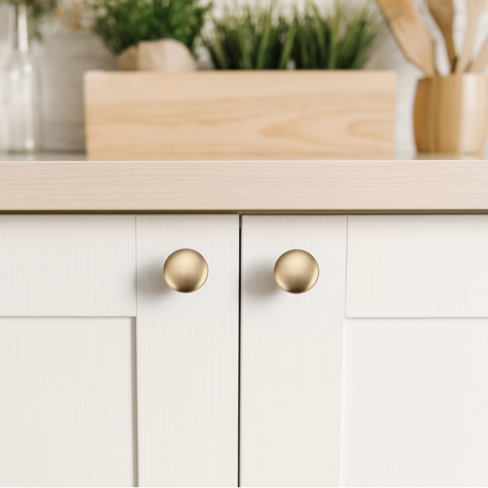 JOY DECOR champagne bronze knob on a drawer front demonstrating smooth daily use