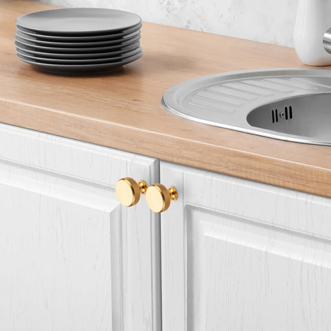 Joy Decor champagne-gold hardware adds timeless shimmer to cabinets.