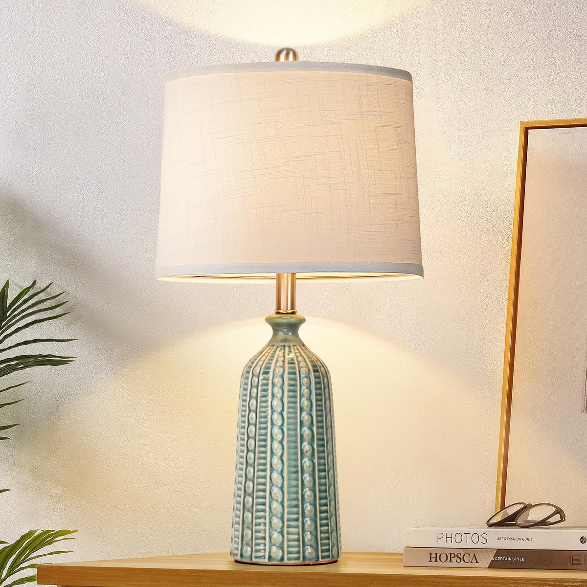 JUNNAI green ceramic table lamp side view, enhances cozy living room ambience.