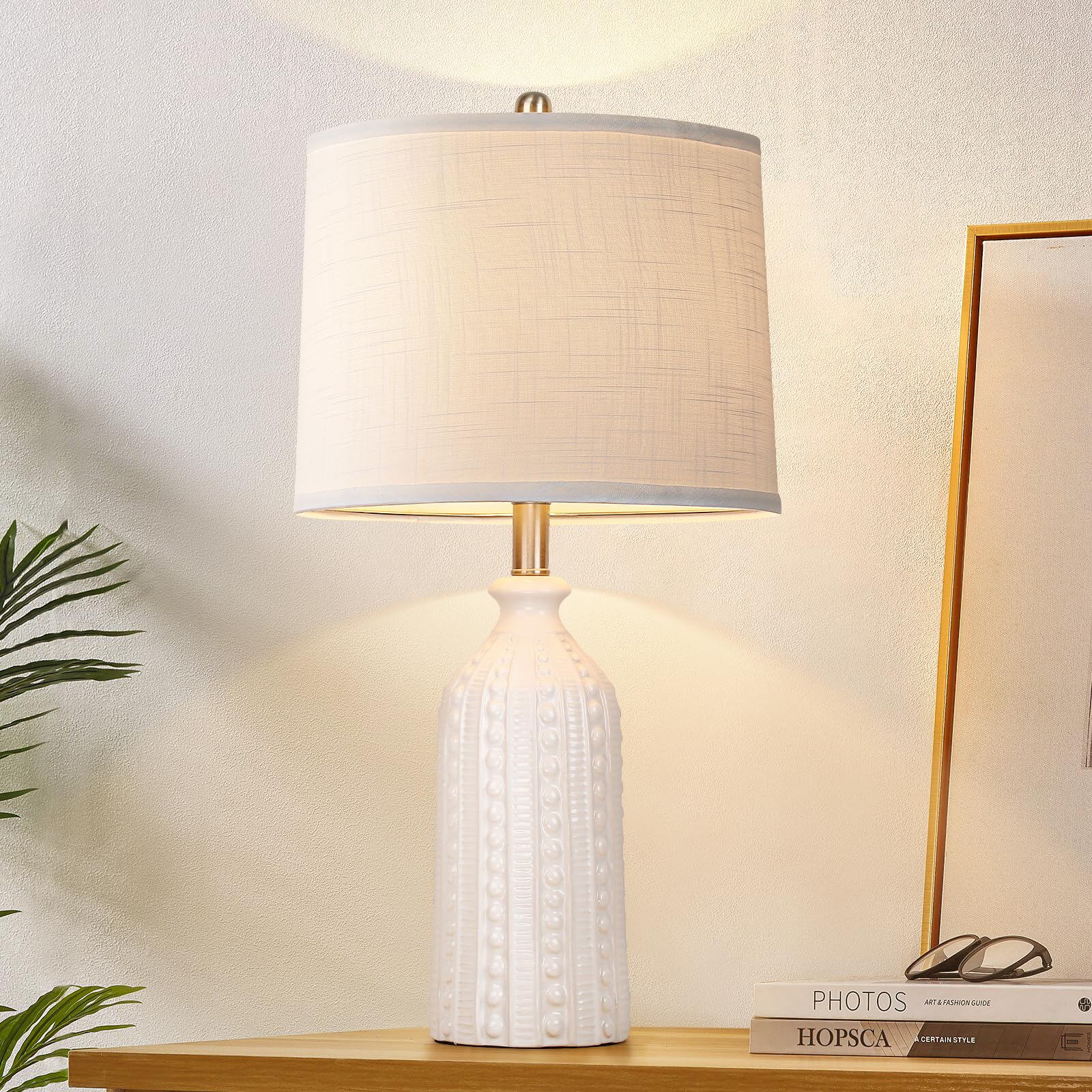JUNNAI white ceramic lamp base provides stable bedside lighting with a soft glow for cozy bedrooms.