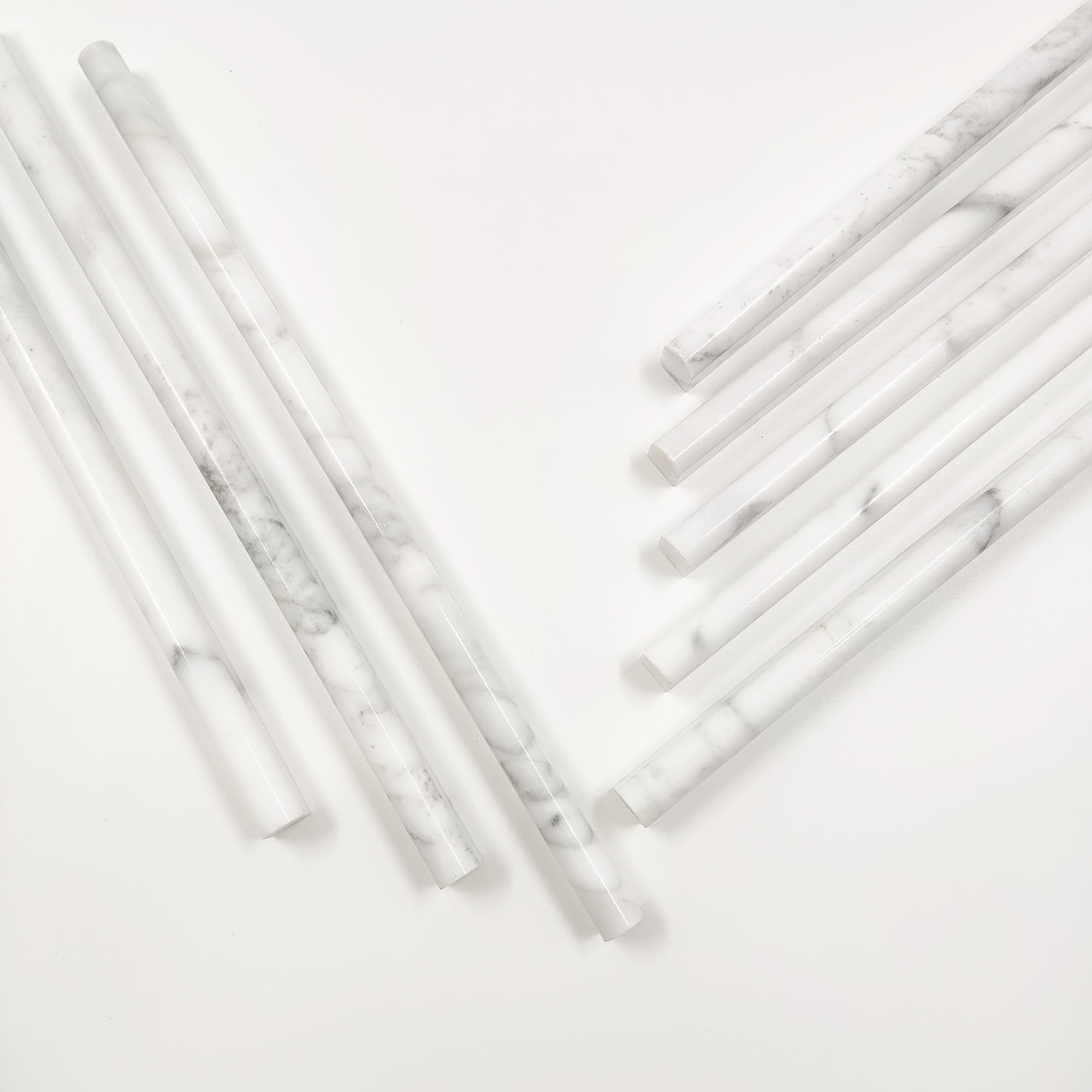 Jusmioke bathroom detail with Carrara white marble pencil liner for elegant finish.