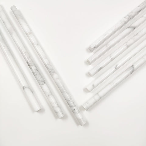 Jusmioke bathroom detail with Carrara white marble pencil liner for elegant finish.