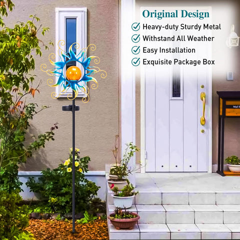 Kacux blue metal sun globe creates shimmering garden ambiance at night.