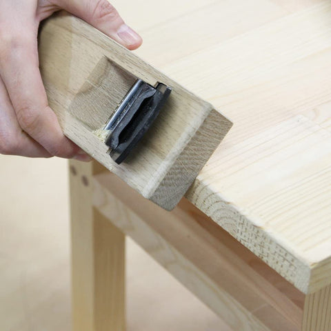KAKURI KanNA plane in action during cutting for precise planing results.