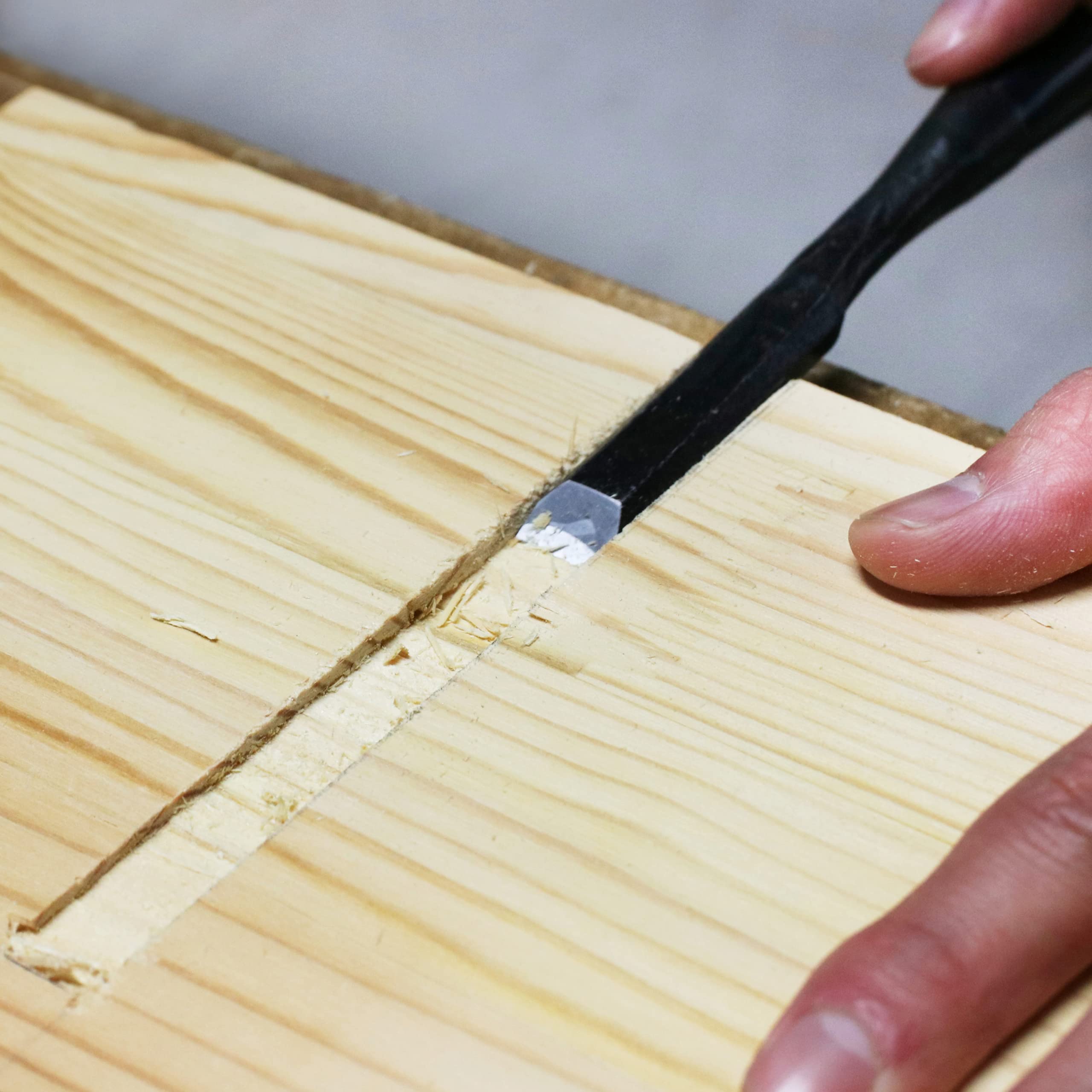 KAKURI Oire Nomi in action for mortising and joinery tasks.