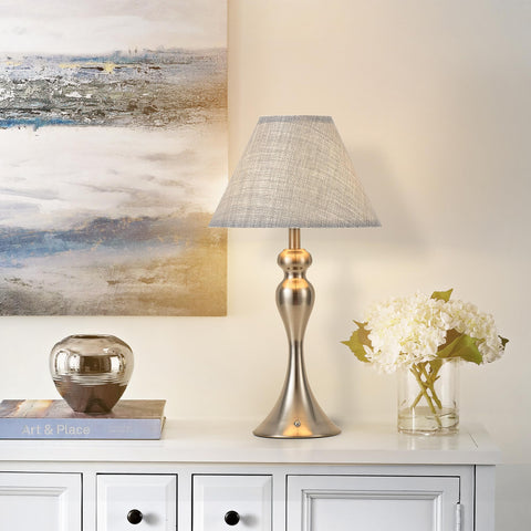 KARTOOSH nickel finish lamp on desk blends modern and vintage decor.