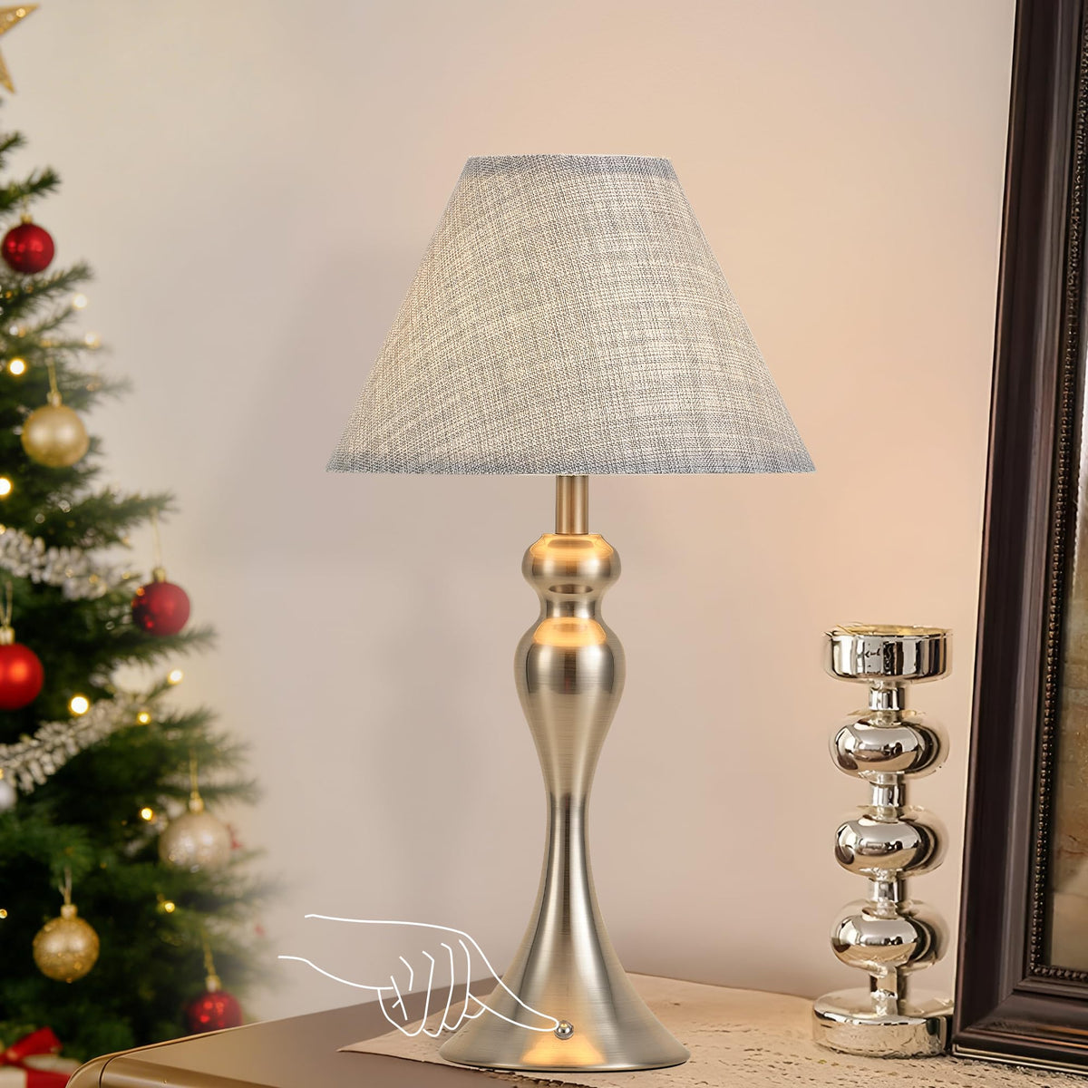 KARTOOSH rechargeable table lamp nickel finish on nightstand provides reading light.