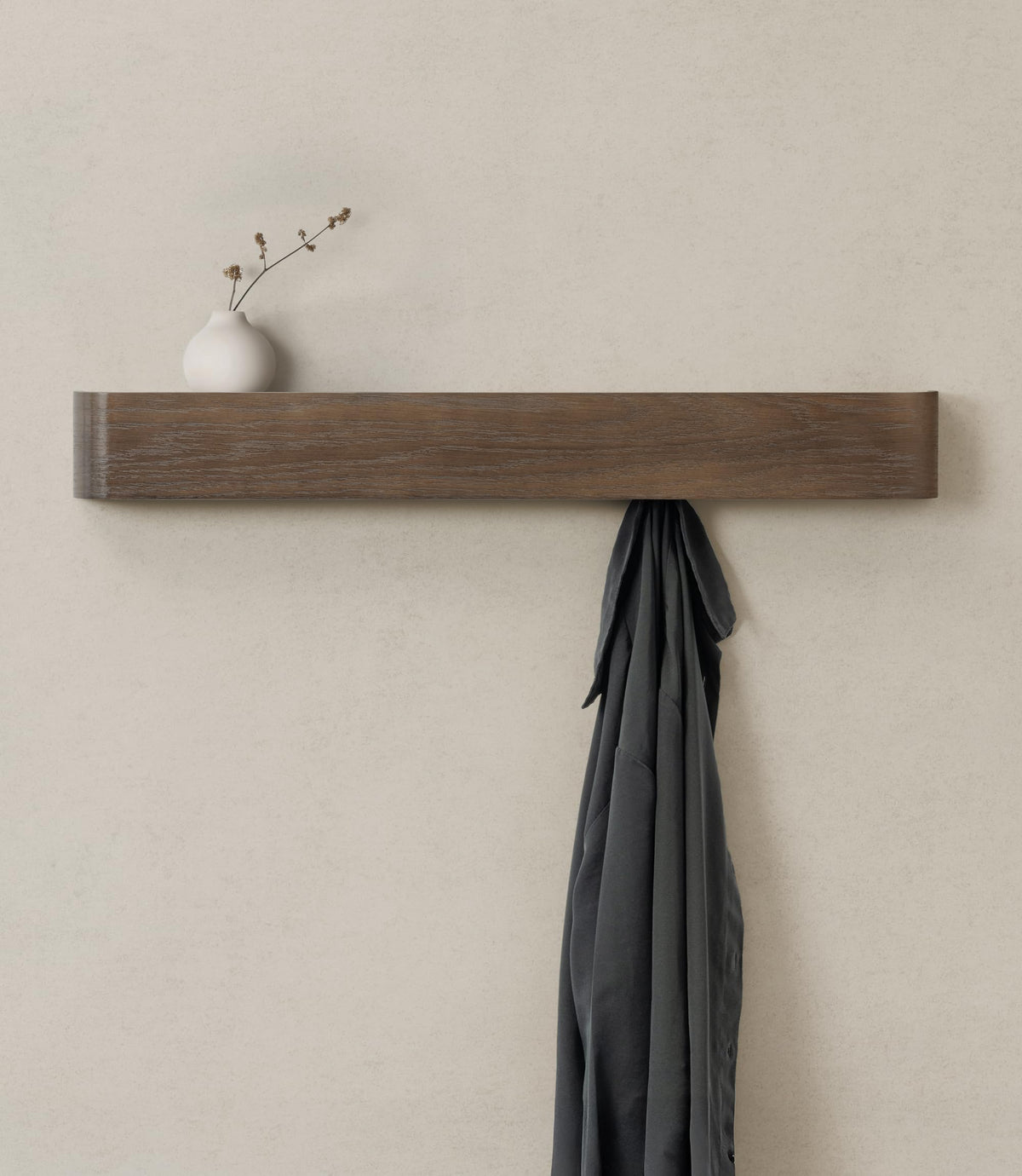 Kazai Toke wall-mounted coat rack shown in a modern entryway with a slim profile and hanging space.