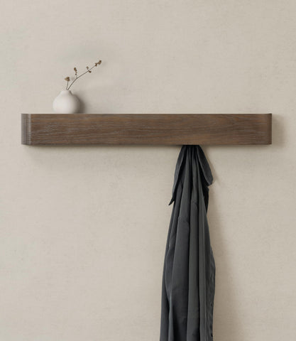 Kazai Toke wall-mounted coat rack shown in a modern entryway with a slim profile and hanging space.