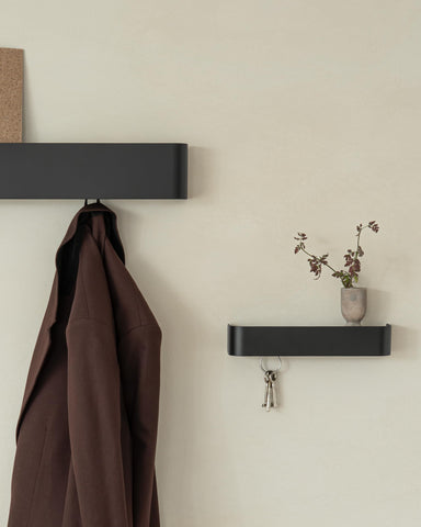Kazai Tone modern metal hanger complements contemporary spaces.