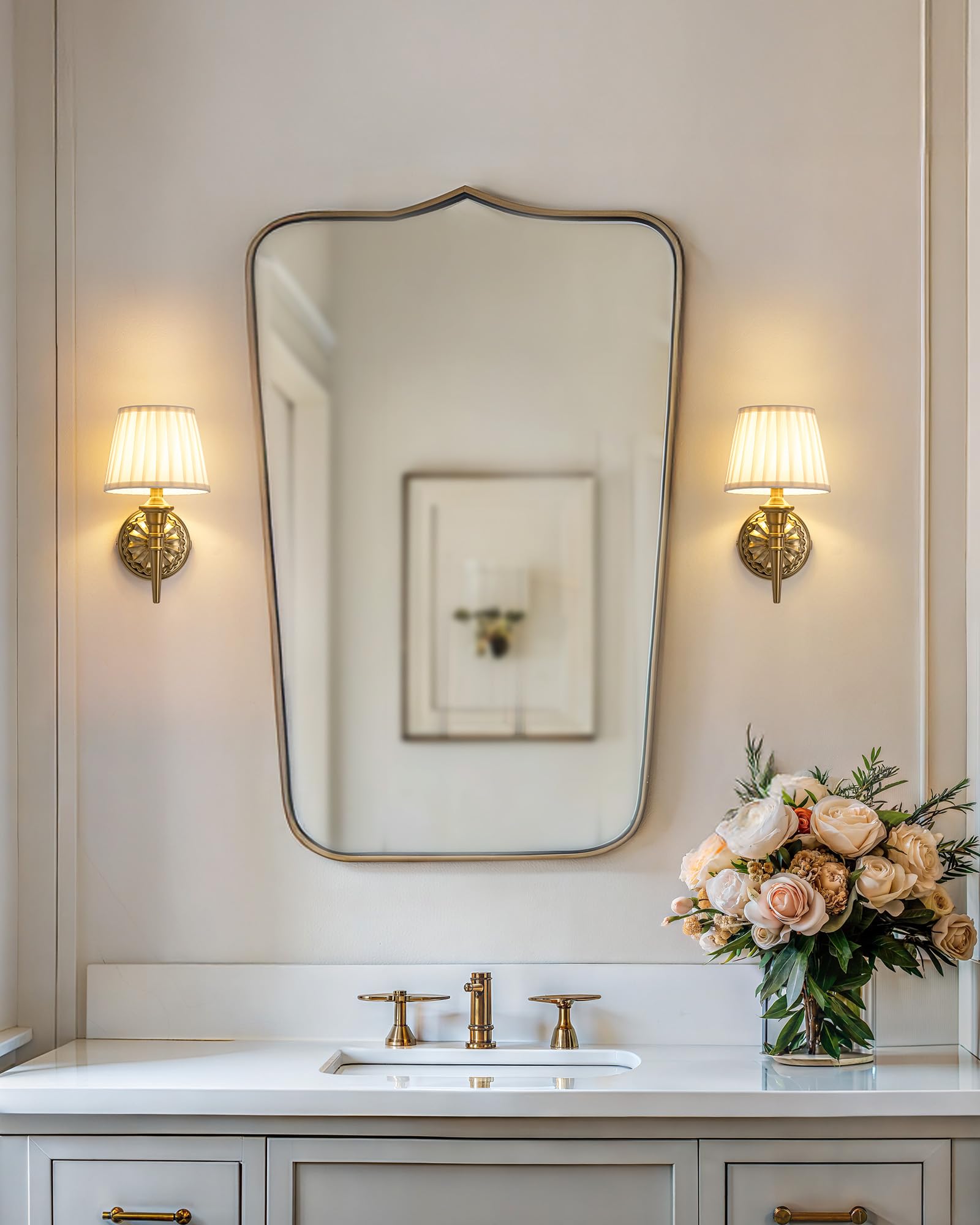 KDG gold cordless wall sconce in a living room setup with warm glow.