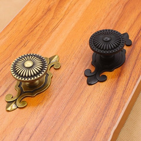 Kelier brass cabinet knob on drawer-front shot for vintage home decor.