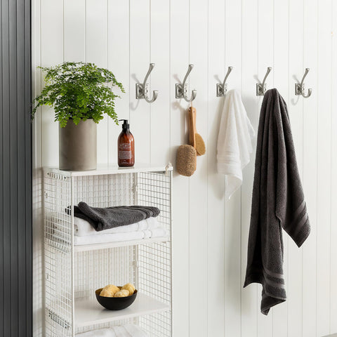 Row of Khtumeware hooks saves space in hallway or mudroom.