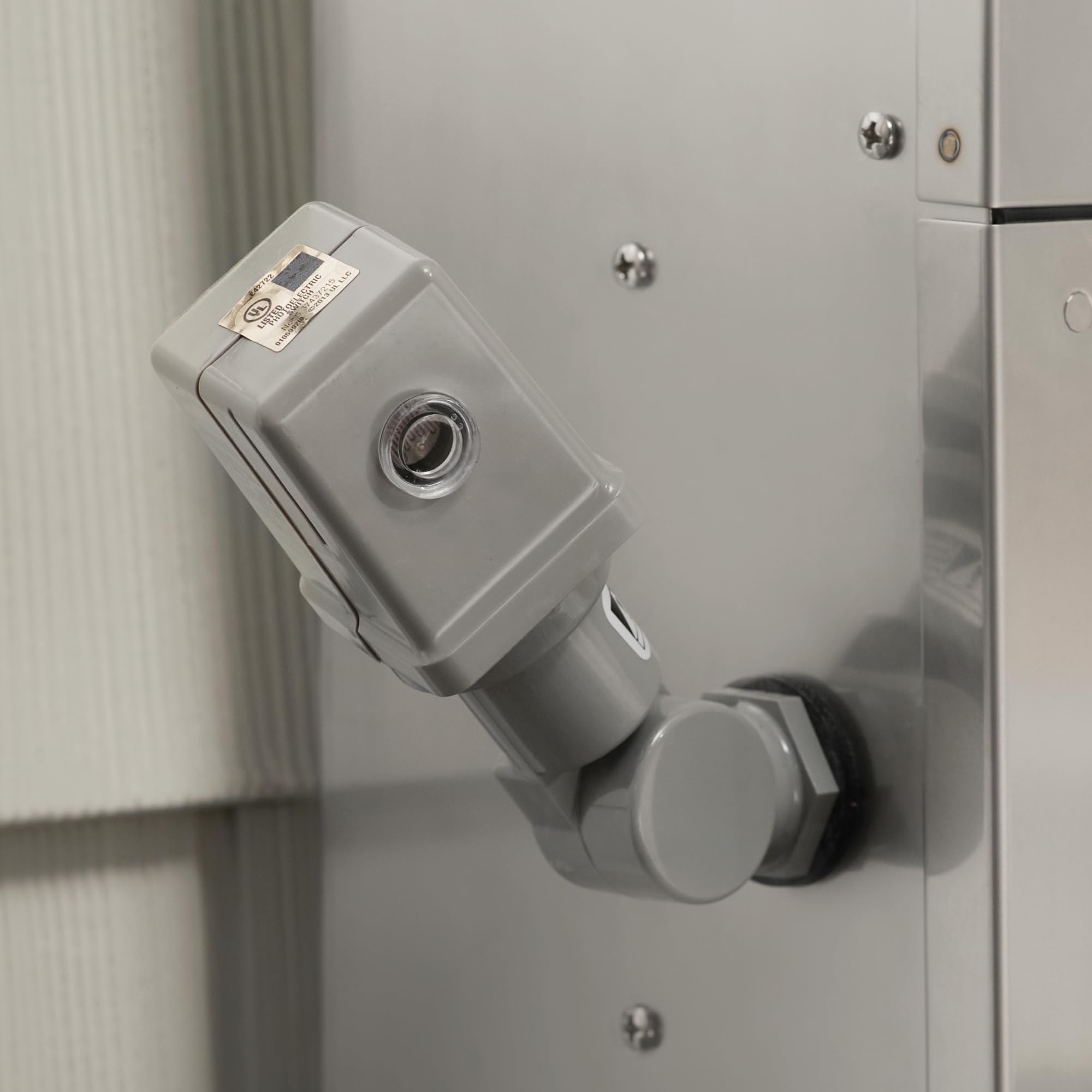 Kichler photocell enabling dusk-to-dawn control with landscape transformers.