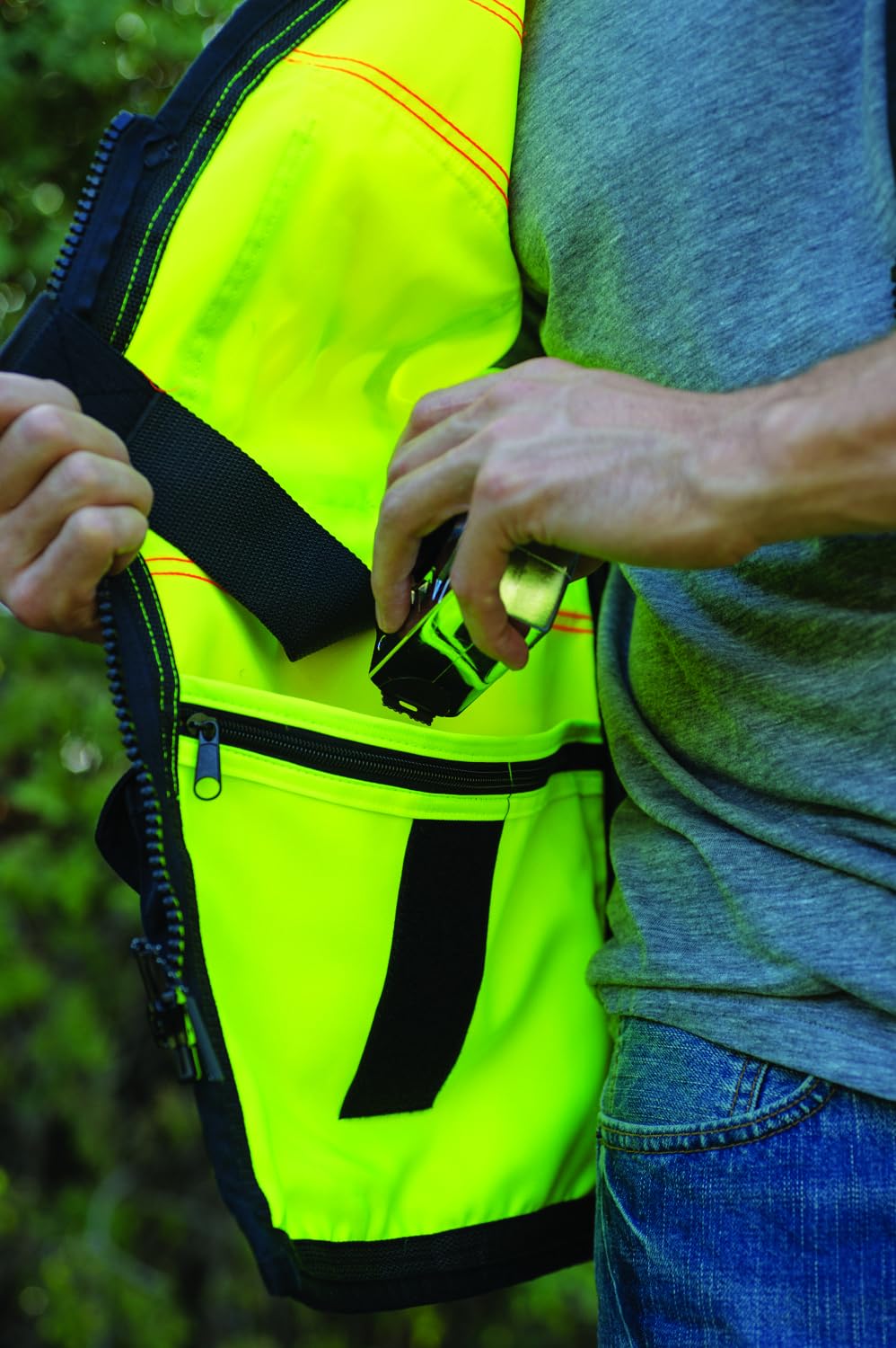 Kishigo Premium Black Series vest elastic spray paint pockets offer quick access for marking tasks.