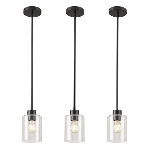 KLSS black seed glass pendant lights in a 3-pack over a modern kitchen island