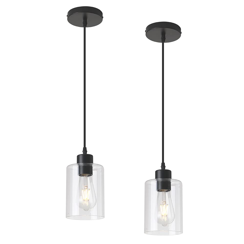 KLSS pendant light over kitchen island provides warm task lighting with a clear glass shade.