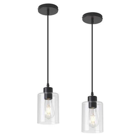 KLSS pendant light over kitchen island provides warm task lighting with a clear glass shade.