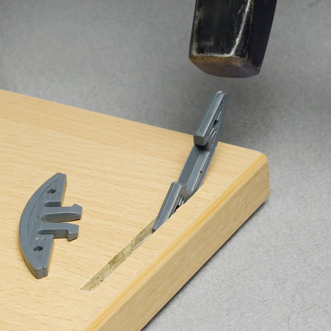 KNAPP biscuit connector half-in-slot demonstrates quick, clamp-free alignment for cabinetry.