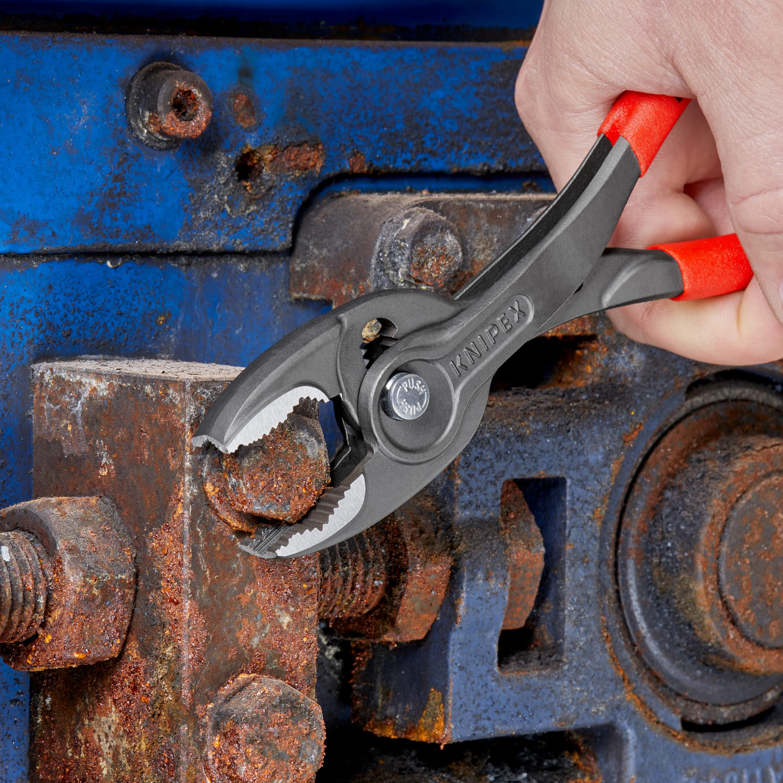 Push-button adjustment on KNIPEX TwinGrip locks jaw width in place