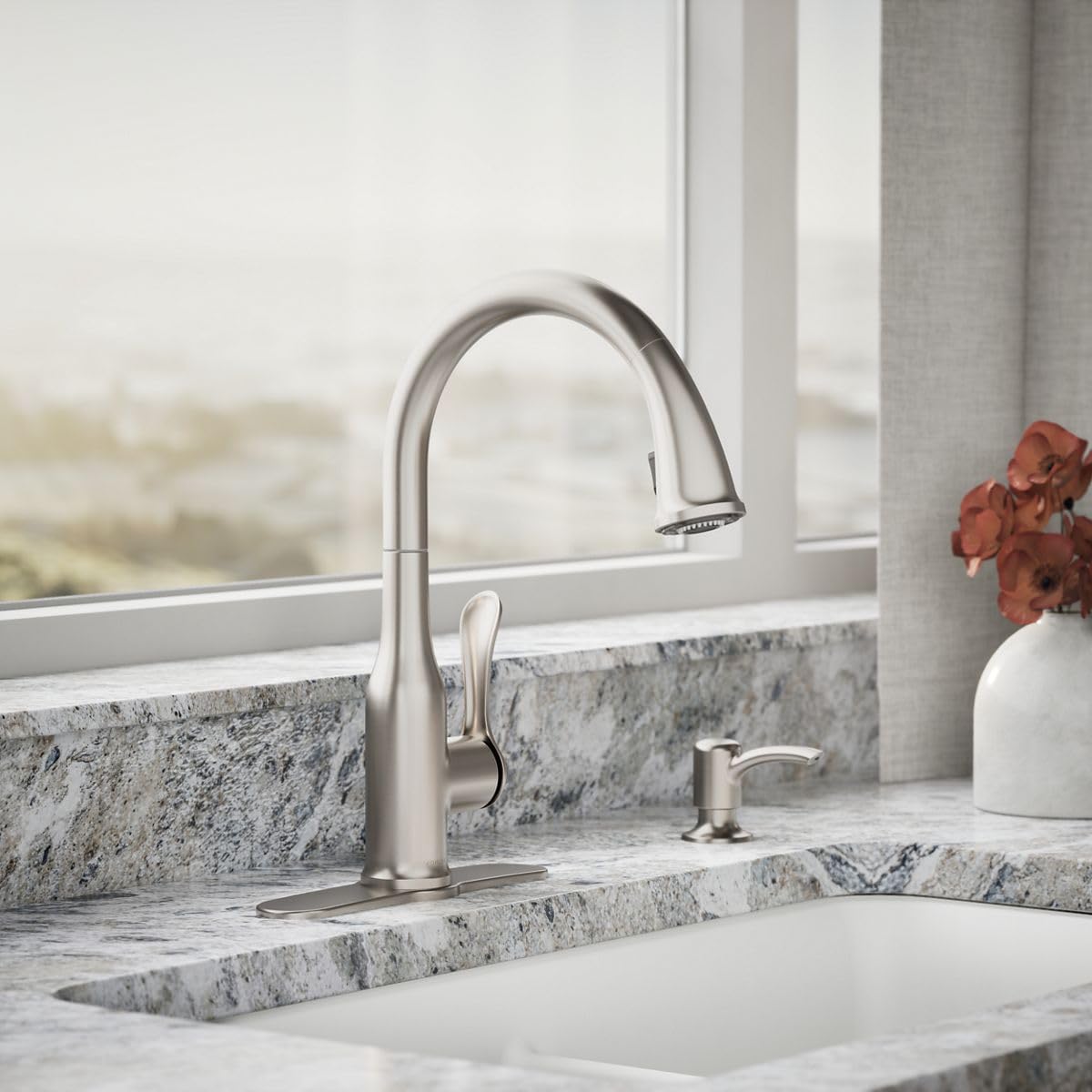 Kohler Motif pull-down sprayer enables easy rinsing and thorough cleaning of dishes.