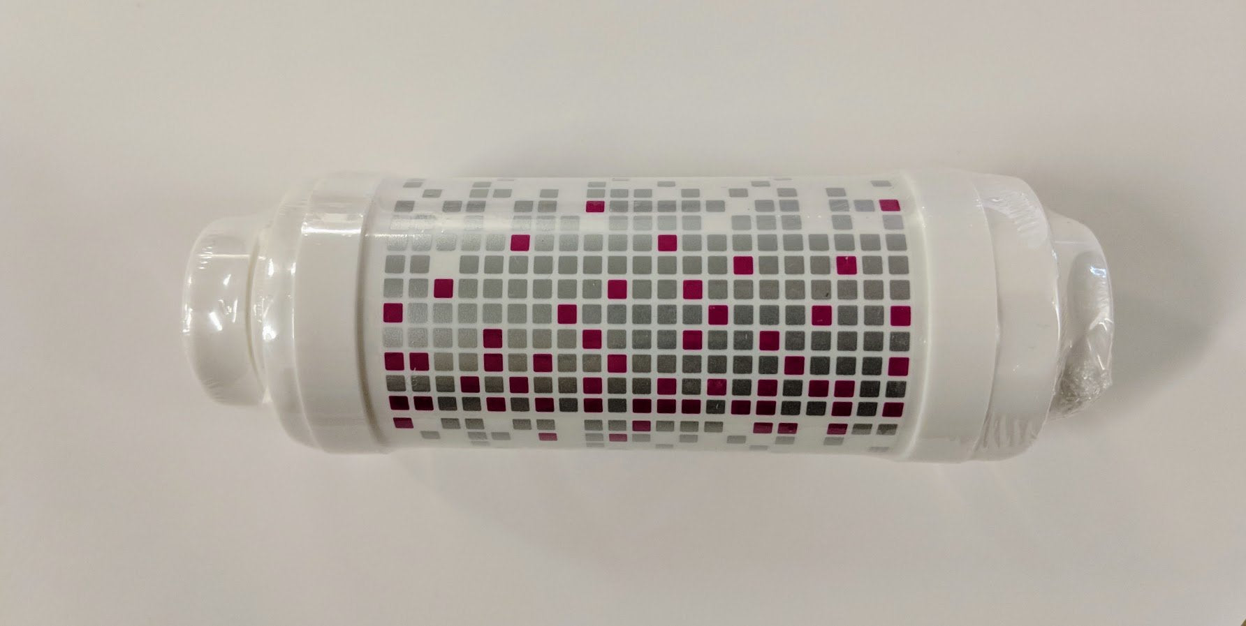 Close-up of filter mesh protecting bidet components from particulates