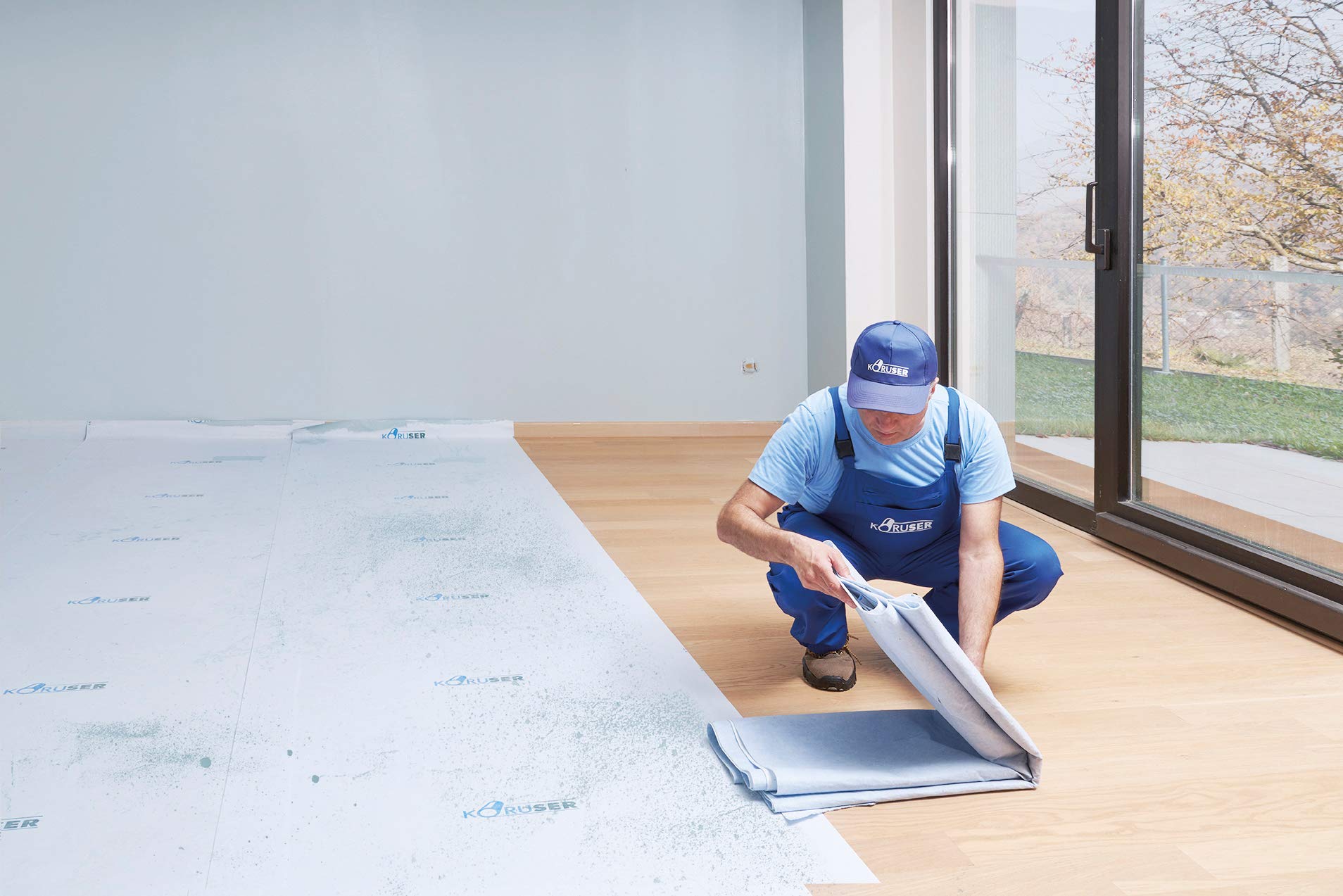 KORUSER paint-proof film protects floors from spills while you work
