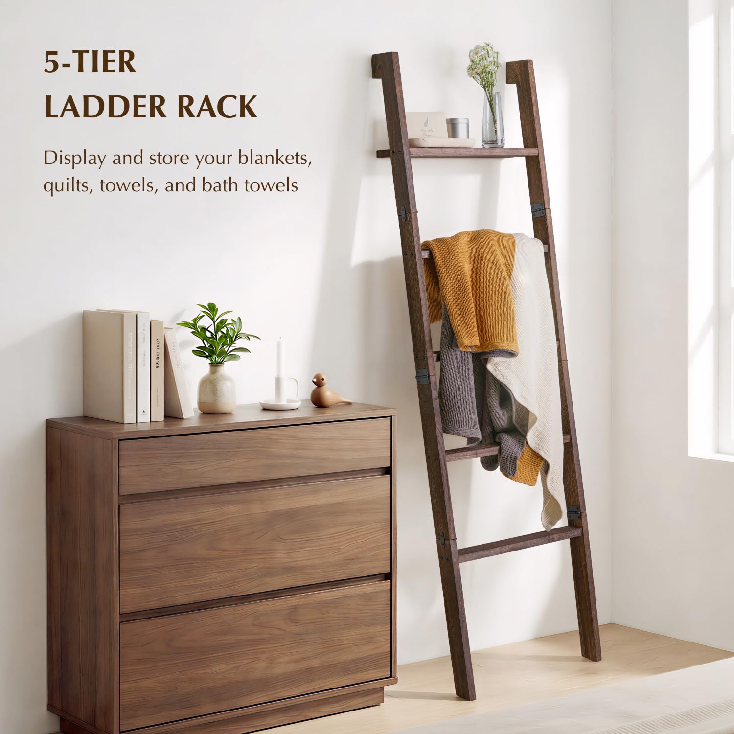 KOSKOG wood ladder holds quilts in the bedroom for easy warmth displays.