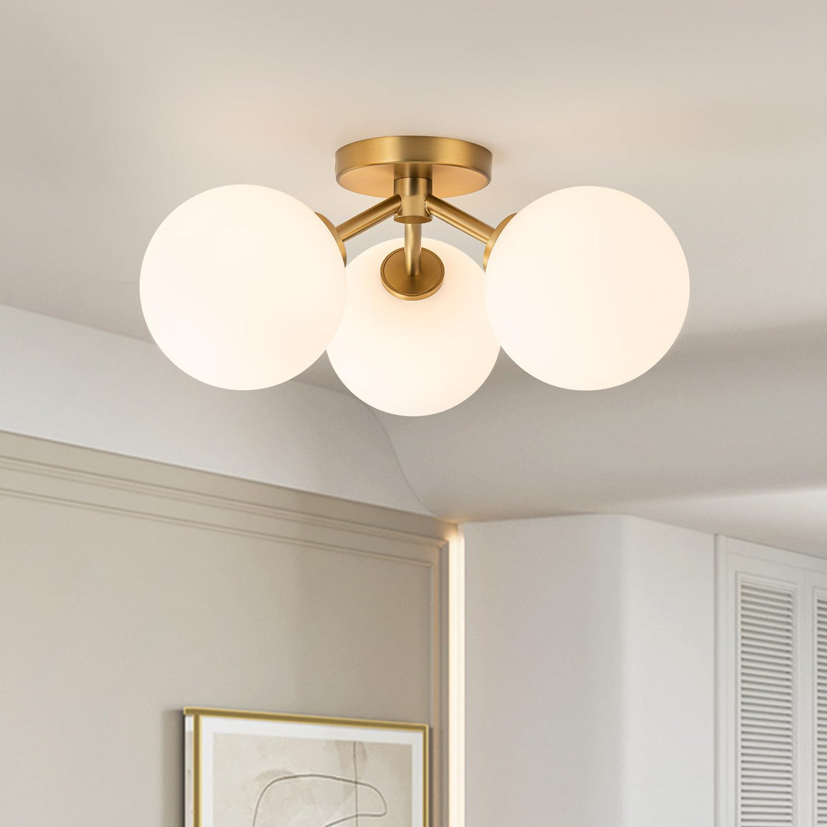 Kunlinzhu mid-century gold semi flush three globe shades create warm entryway illumination.