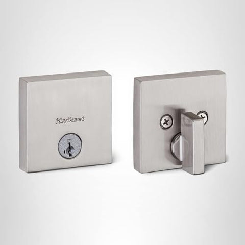 Kwikset Downtown satin nickel finish on modern door hardware detail