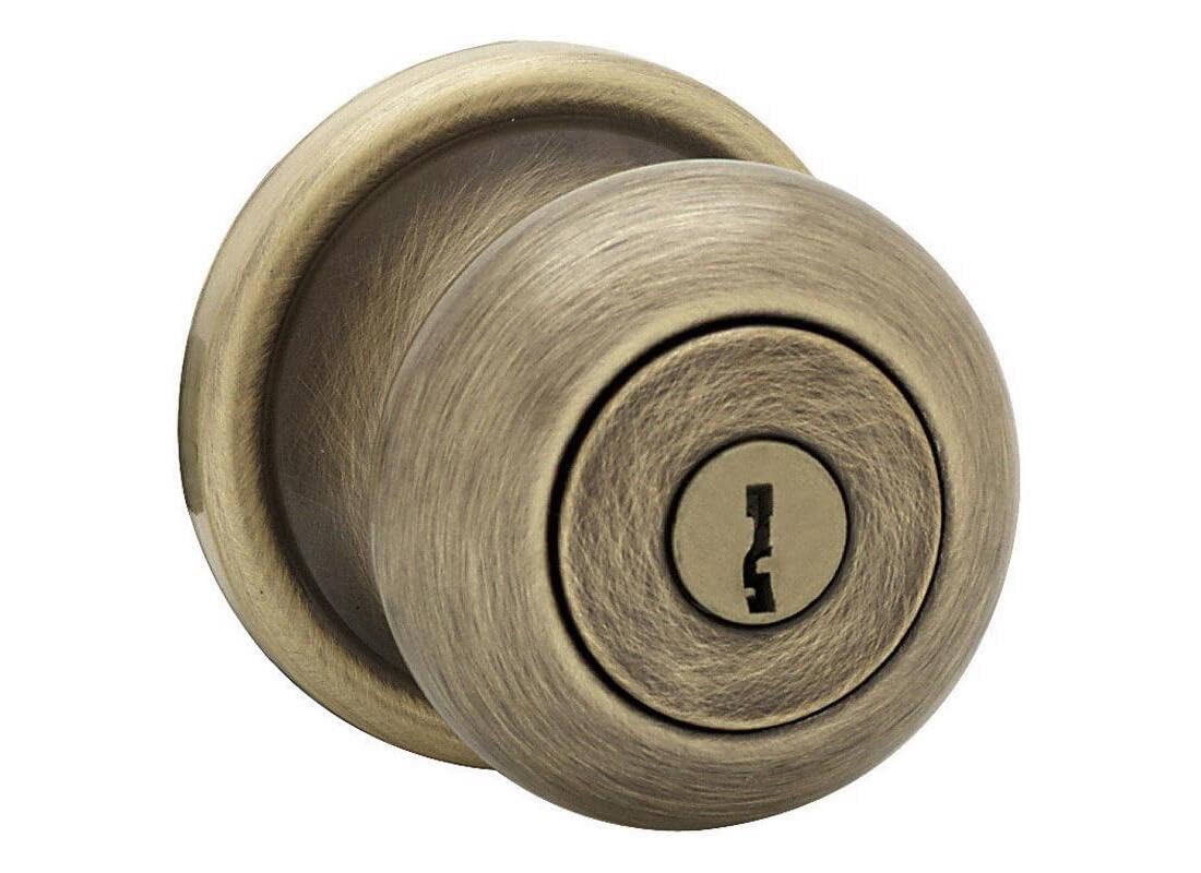 Kwikset Juno entry knob front exterior in antique brass shows secure entry for home use