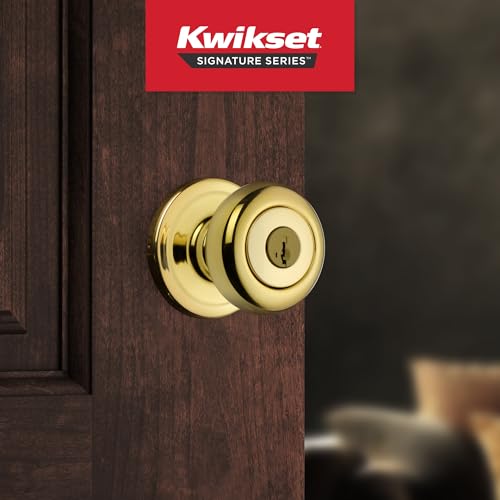 Kwikset Juno exterior knob with key access in polished brass