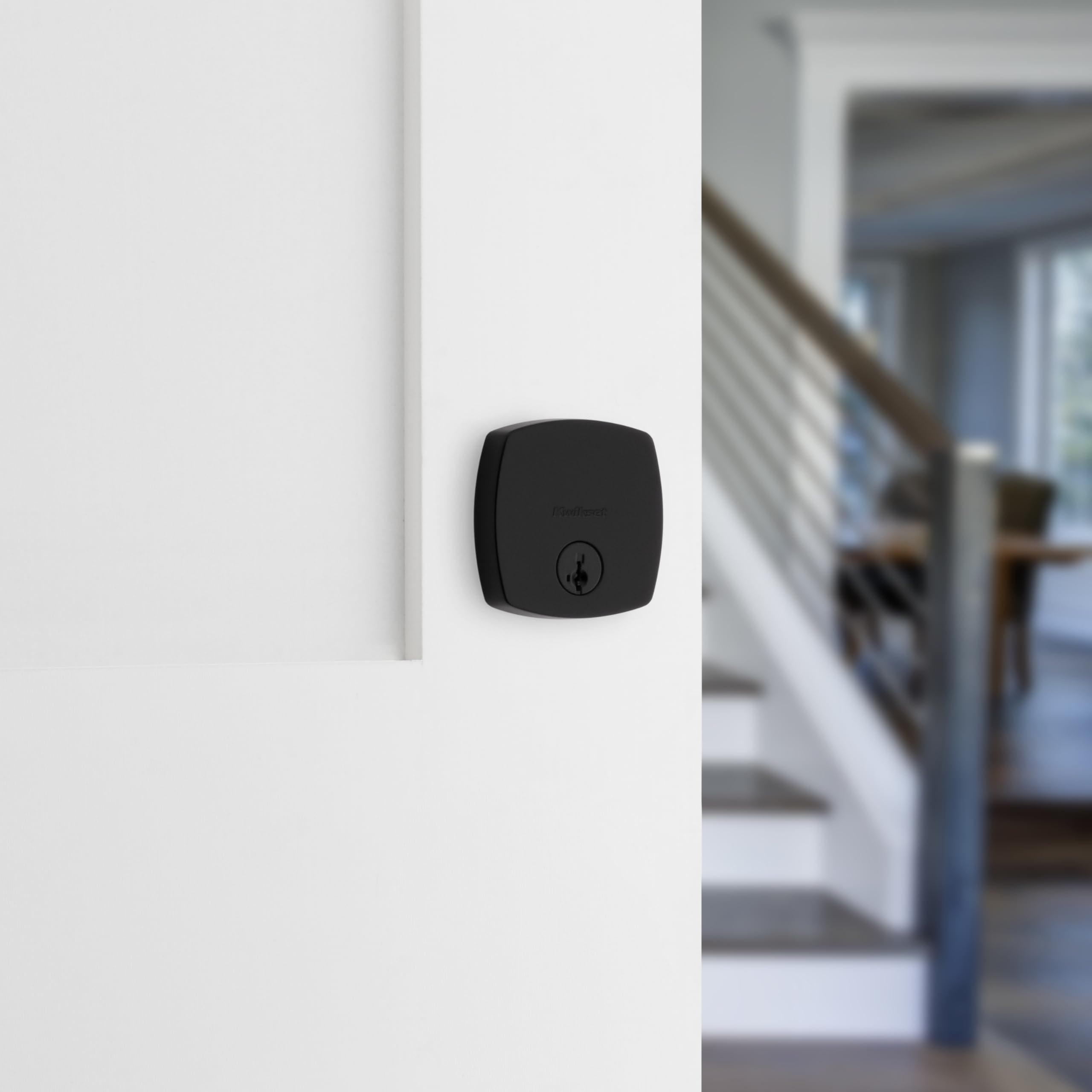 Kwikset Midtown deadbolt interior thumb-turn for convenient locking.