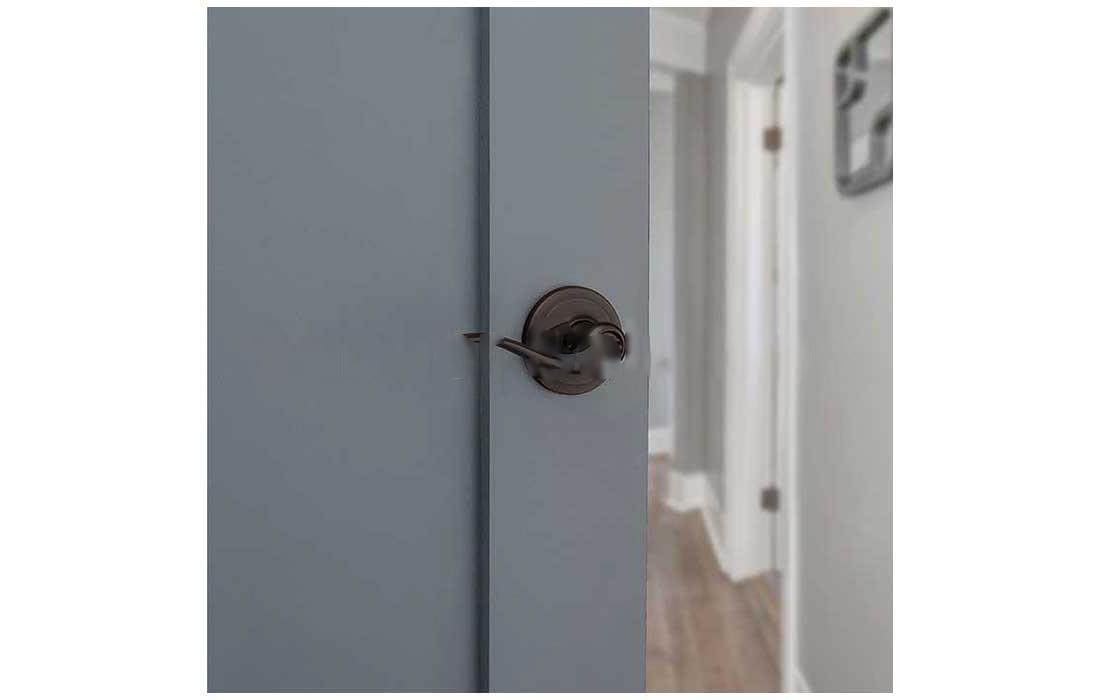 Box contents of Kwikset Tustin privacy lever and latch