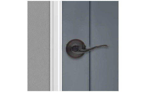Close-up of Kwikset Tustin interior door handle showing wave-inspired design