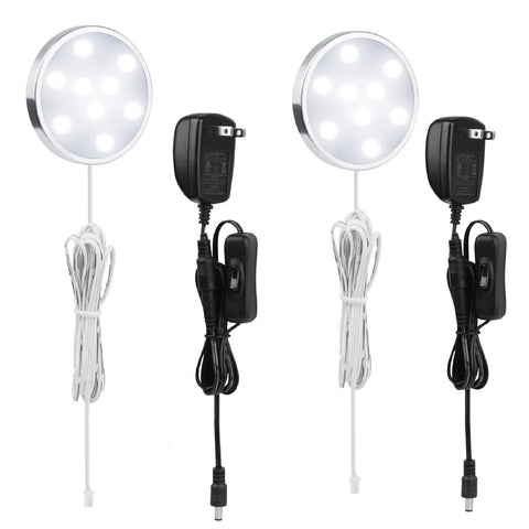 LABOREDUCER 12V under-cabinet puck lights two-pack illuminate countertops with clean 6000K cool white.